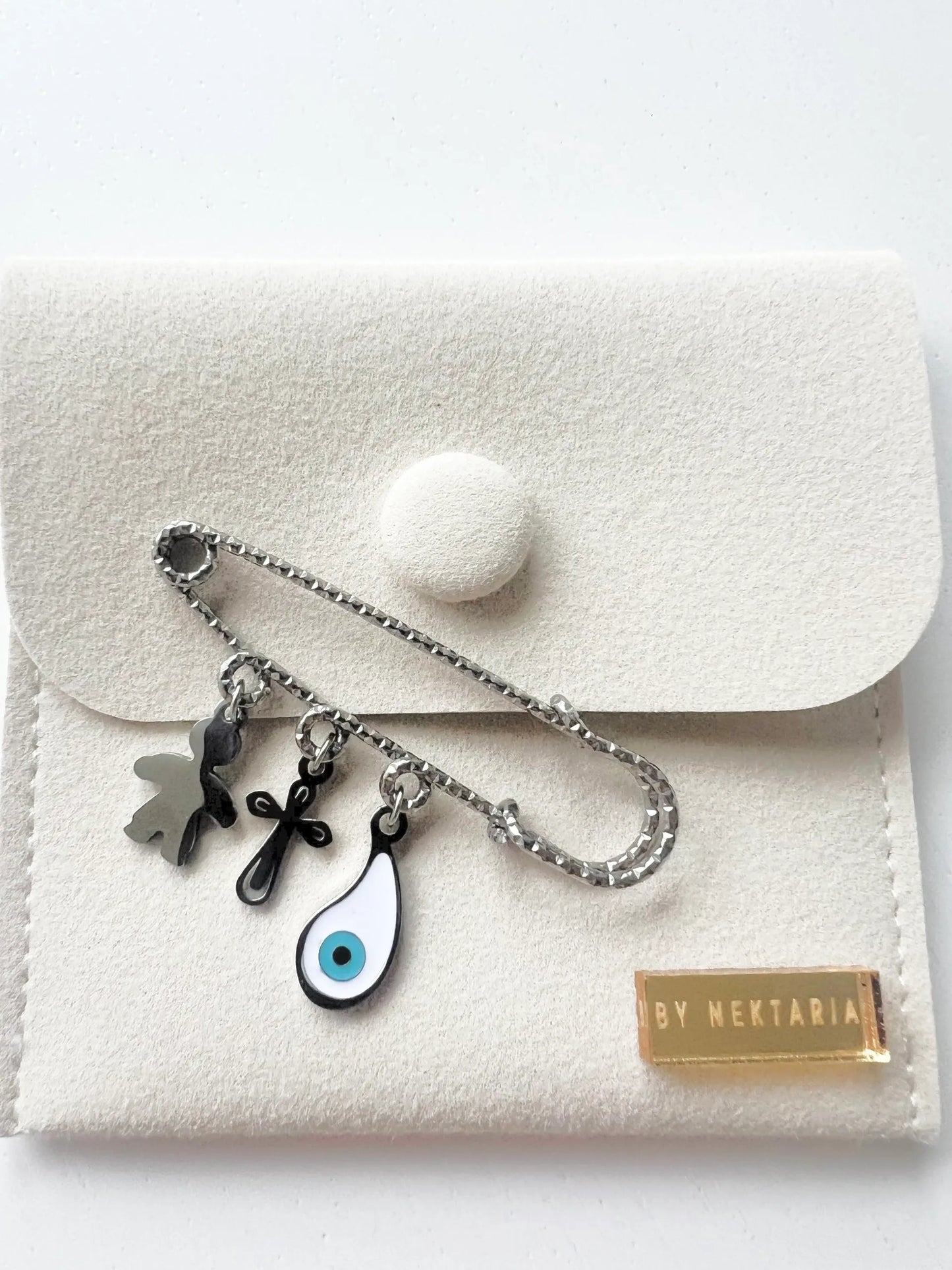 Silver protection pin featuring white mati charm, cross & angel charm